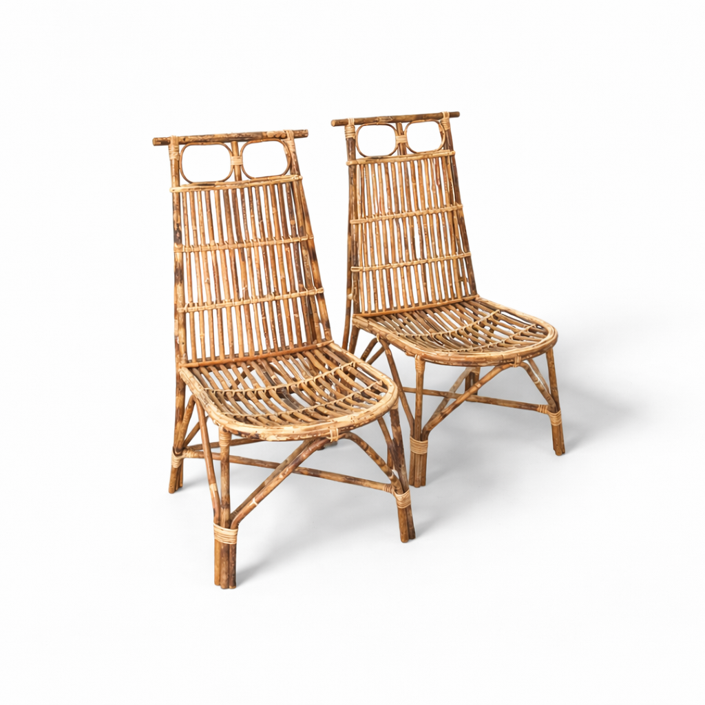 Two wicker chairs on a white background