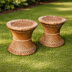 Two wicker side tables on a grassy lawn