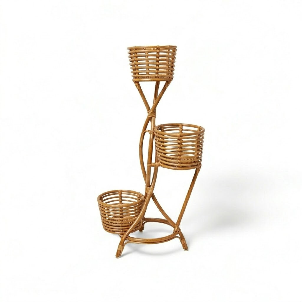 Wicker plant stand with three baskets on a white background